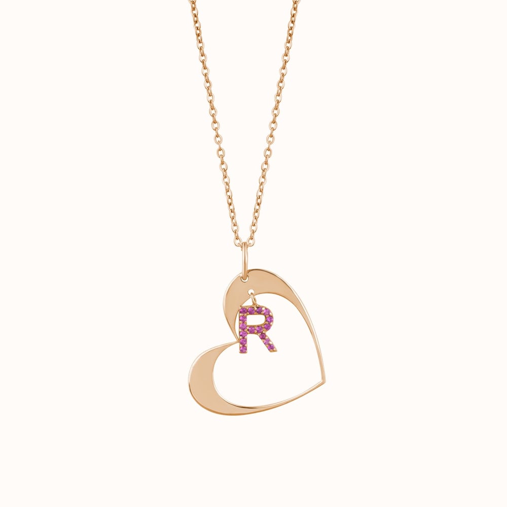 Rose gold heart pendant necklace with a crystal letter R charm — the product photo the listing was written from